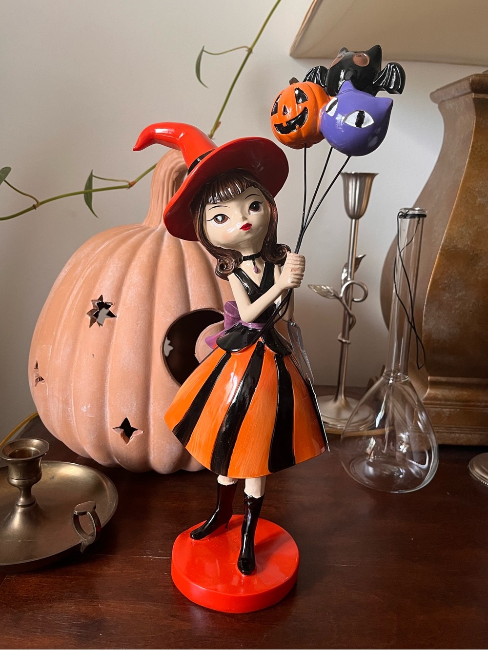 Bella Lux Halloween Witch Girl Holding Balloons Figurine in Orange & Red 🕸️